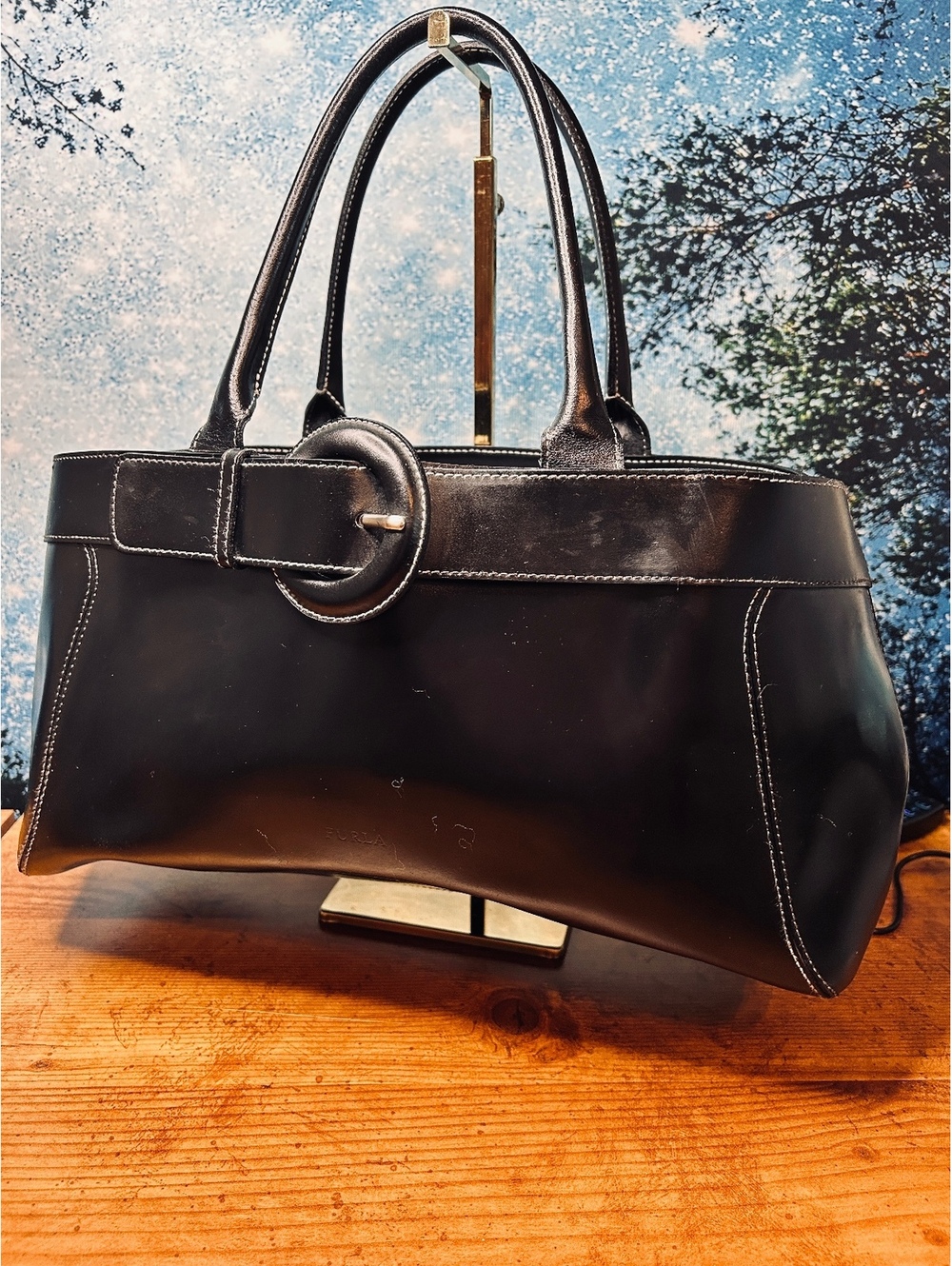 Furla Black Leather Gisele tote bag featuring a prominent central buckle
